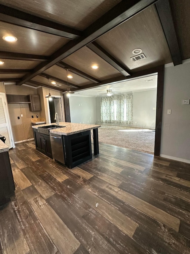 kitchen featuring a center island with sink, visible vents, dark wood-type flooring, a sink, and dishwasher