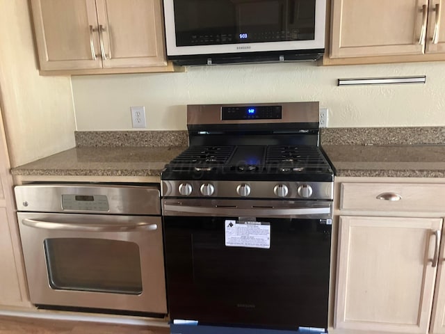 4004 Terrace, Amarillo, TX 79109 - kitchen with stainless steel appliances and dark countertops