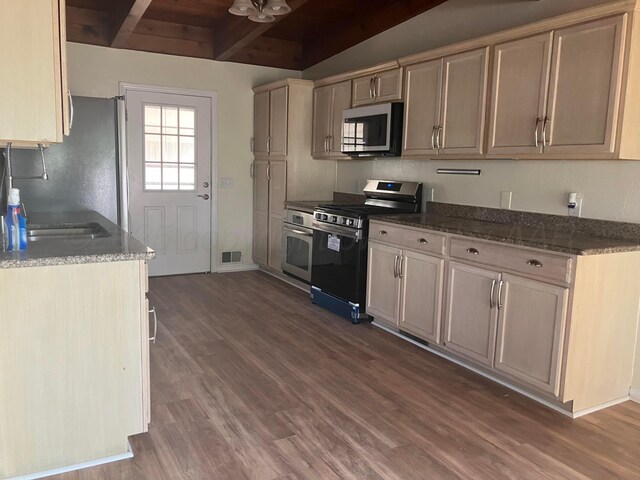 4004 Terrace, Amarillo, TX 79109 - kitchen featuring stainless steel appliances, dark wood finished floors, dark stone countertops, wood ceiling with exposed beams, and a sink