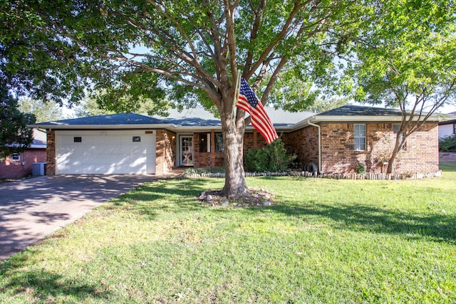 ranch-style home featuring a garage and a front yard