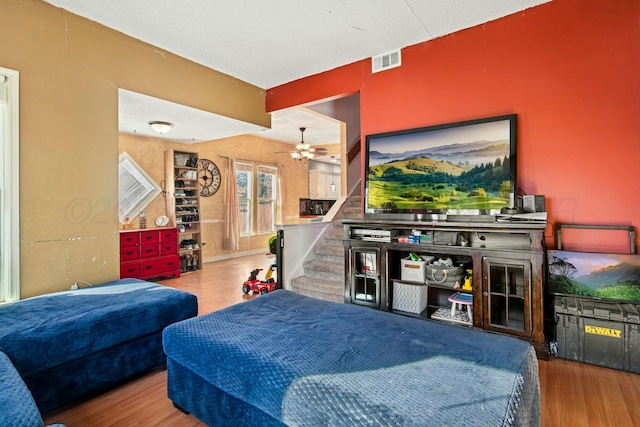 bedroom featuring visible vents and wood finished floors