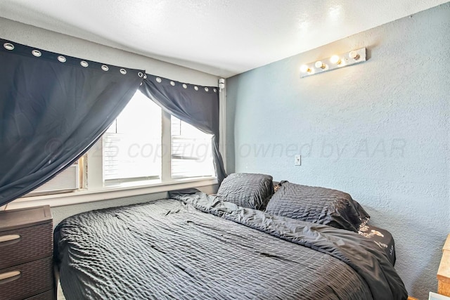 bedroom with a textured wall