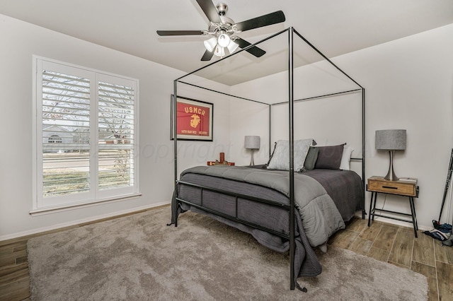 bedroom featuring hardwood / wood-style floors and ceiling fan