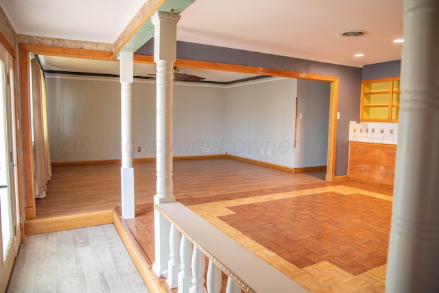 hallway featuring hardwood / wood-style flooring and crown molding