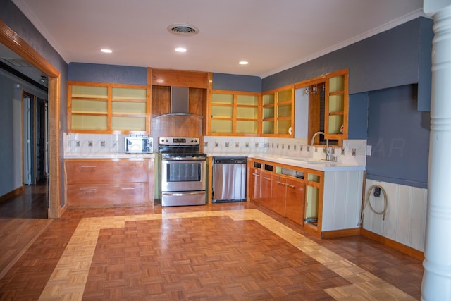 kitchen with sink, light parquet flooring, wall chimney range hood, and appliances with stainless steel finishes