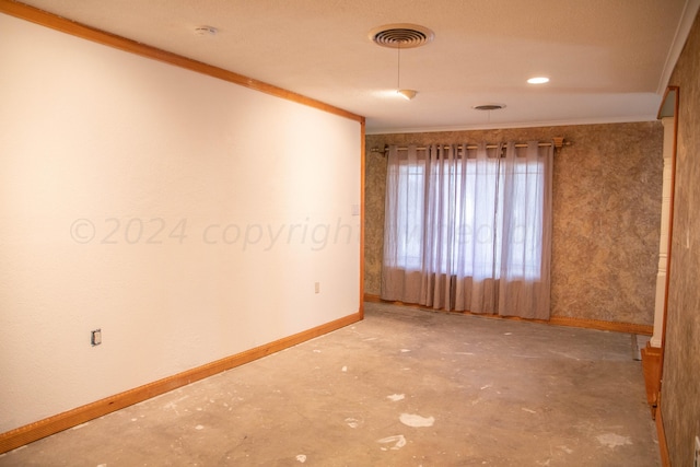 spare room featuring ornamental molding