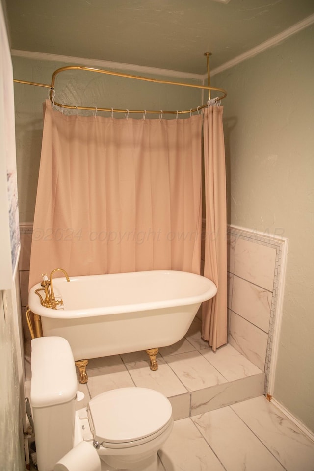 bathroom featuring toilet and ornamental molding