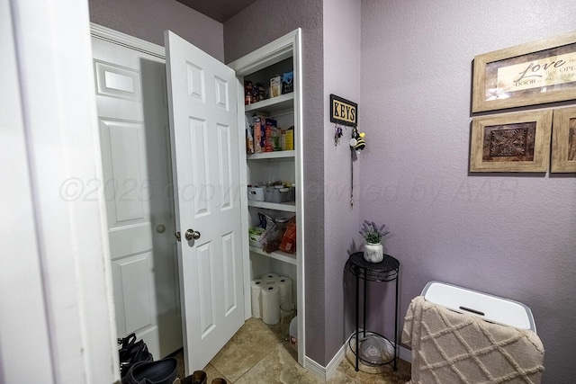 4908 Gloster St, Amarillo, TX 79118 - bathroom with a textured wall and tile patterned flooring