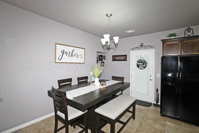 4908 Gloster St, Amarillo, TX 79118 - dining area with a chandelier, baseboards, and light tile patterned floors