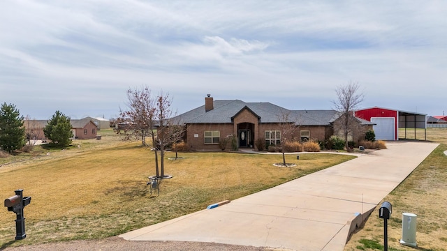 single story home with a front yard, an outbuilding, driveway, a chimney, and a garage