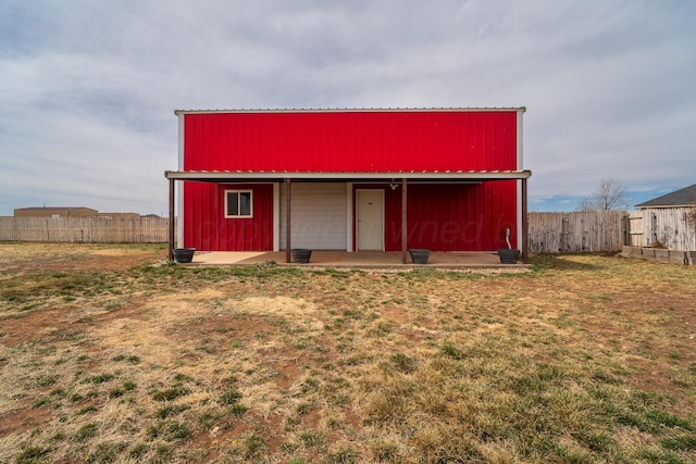 view of outbuilding with an outbuilding and fence