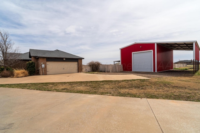 garage with a garage and fence