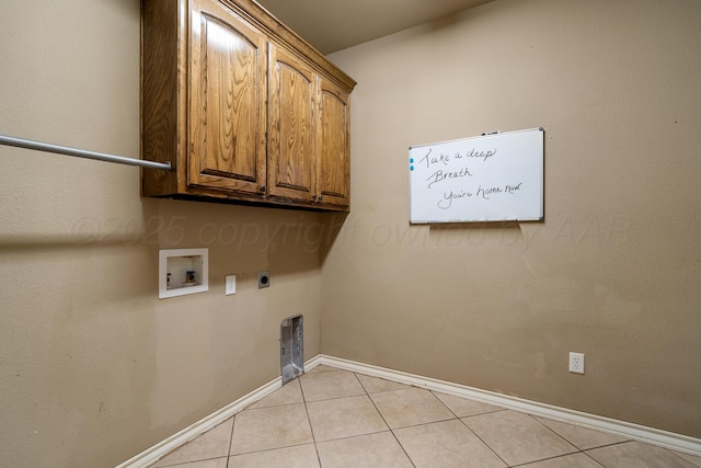washroom featuring baseboards, hookup for a washing machine, light tile patterned flooring, cabinet space, and electric dryer hookup