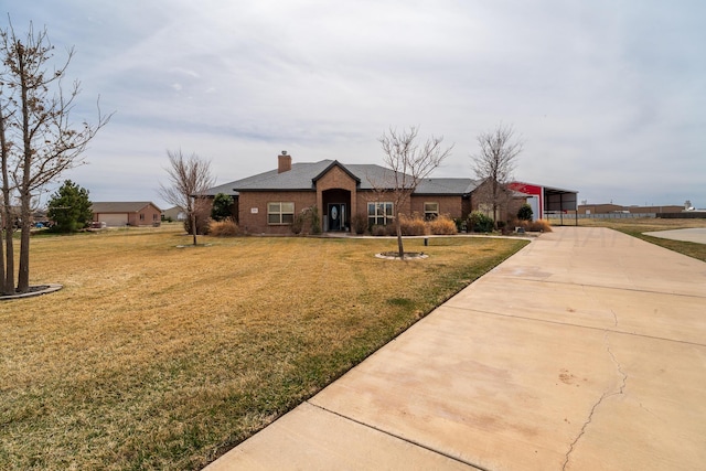 ranch-style home with driveway, a chimney, and a front yard