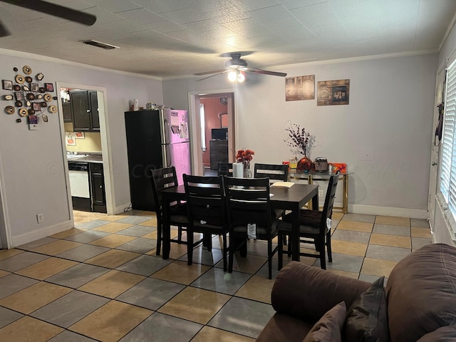 tiled dining room with ornamental molding, a healthy amount of sunlight, and ceiling fan