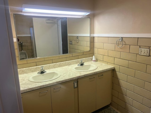 3601 NE 13th Ave, Amarillo, TX 79107 - bathroom with tile walls, double vanity, and wainscoting