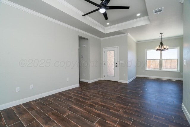 1634 Northridge St, Dumas, TX 79029 - unfurnished room with wood tiled floors, a raised ceiling, ceiling fan, baseboards, and a chandelier