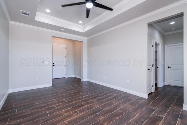 1634 Northridge St, Dumas, TX 79029 - spare room with a ceiling fan, wood tiled floors, a raised ceiling, baseboards, and ornamental molding