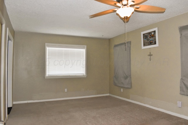 501 Bruce Ave, Dumas, TX 79029 - carpeted empty room featuring a textured ceiling and a ceiling fan
