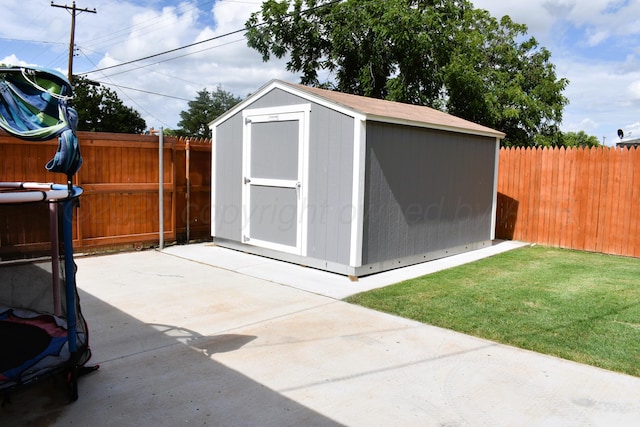 501 Bruce Ave, Dumas, TX 79029 - view of shed with a fenced backyard