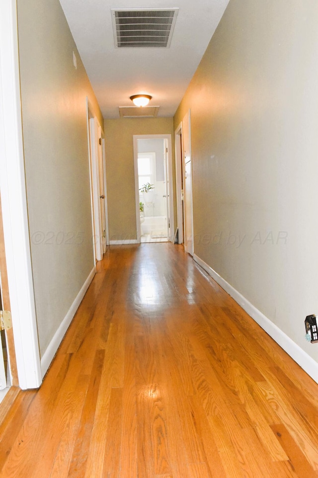 501 Bruce Ave, Dumas, TX 79029 - hall with wood finished floors and attic access