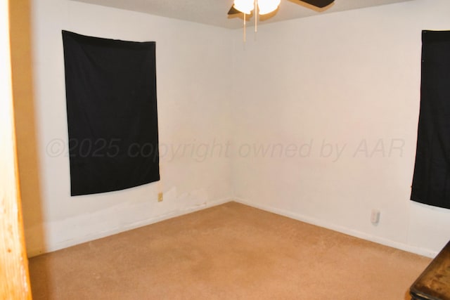 501 Bruce Ave, Dumas, TX 79029 - spare room featuring carpet and a ceiling fan