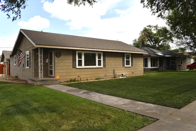 501 Bruce Ave, Dumas, TX 79029 - ranch-style home with a front yard and a shingled roof