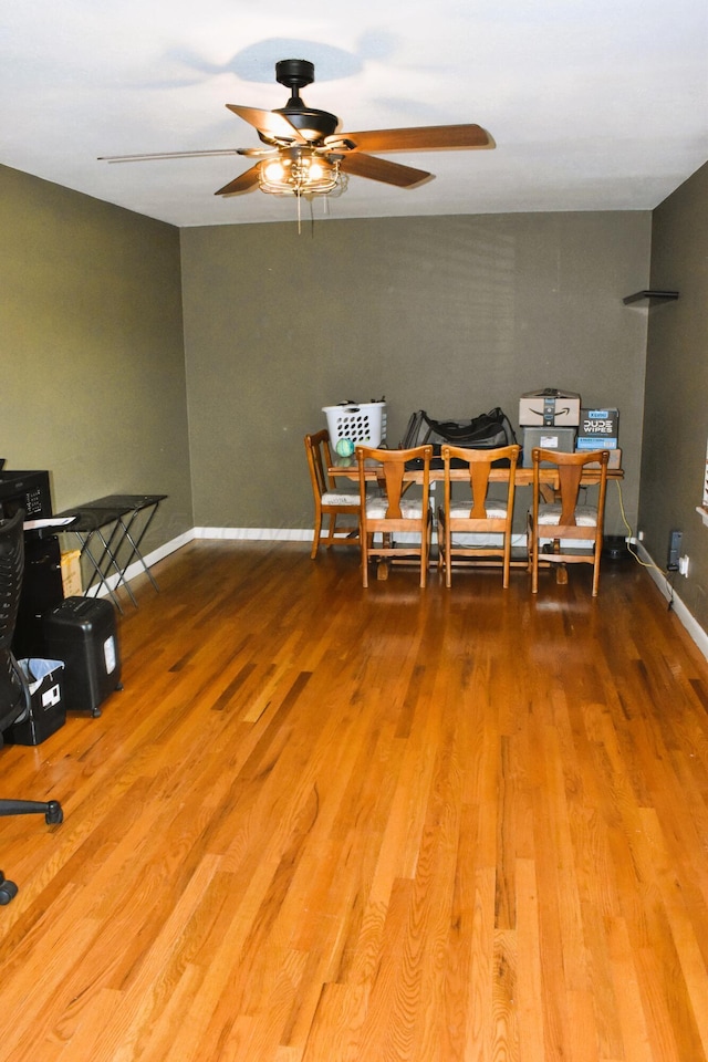 501 Bruce Ave, Dumas, TX 79029 - dining space with a ceiling fan and wood finished floors