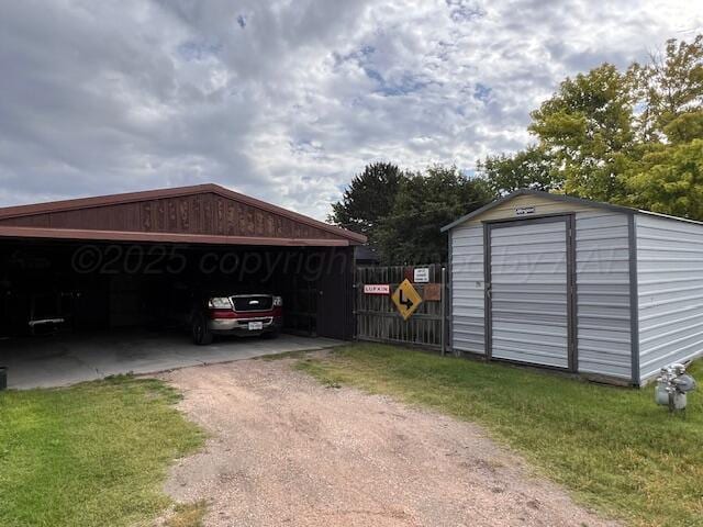 204 SE 15th Ave, Perryton, TX 79070 - detached garage featuring a storage shed