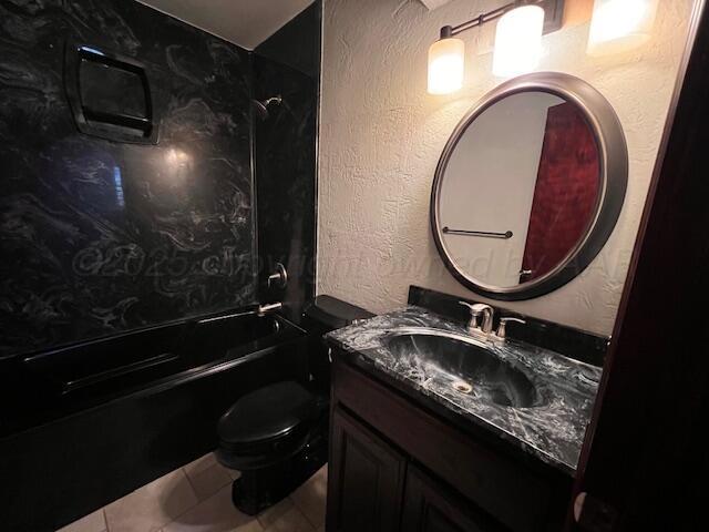 204 SE 15th Ave, Perryton, TX 79070 - full bath featuring vanity, bathtub / shower combination, and tile patterned flooring
