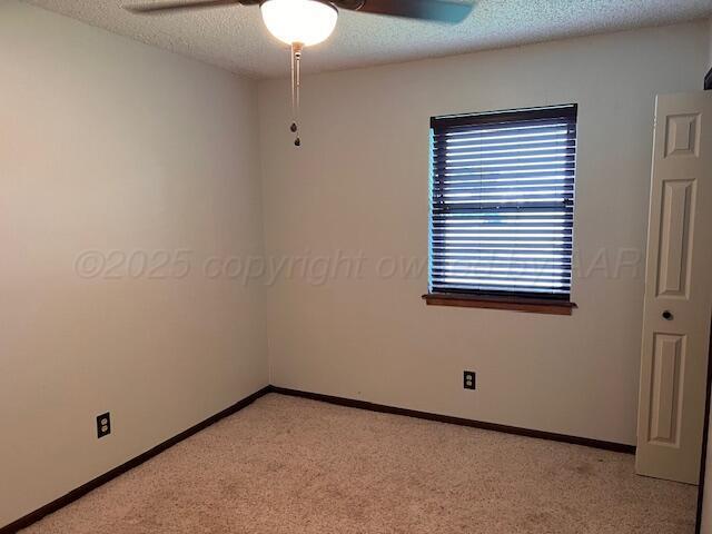 204 SE 15th Ave, Perryton, TX 79070 - spare room featuring ceiling fan, light carpet, and a textured ceiling