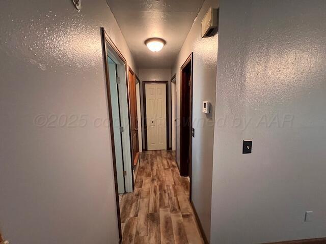 204 SE 15th Ave, Perryton, TX 79070 - corridor featuring wood finished floors