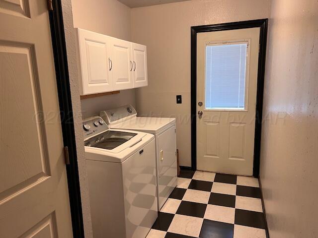 204 SE 15th Ave, Perryton, TX 79070 - washroom featuring cabinet space, washer and clothes dryer, and light floors