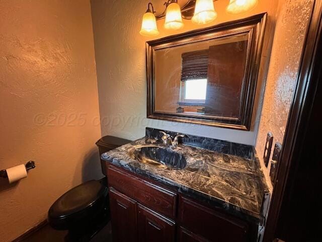 204 SE 15th Ave, Perryton, TX 79070 - bathroom with vanity and a textured wall
