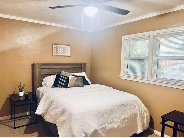 bedroom with ceiling fan and ornamental molding