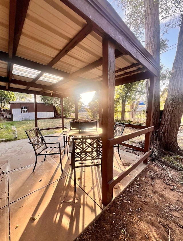 view of patio / terrace featuring a shed