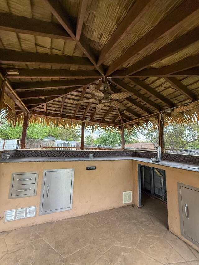 219 Kiekbusch St, Borger, TX 79007 - view of patio with an outdoor kitchen, visible vents, and a ceiling fan