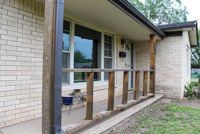 219 Kiekbusch St, Borger, TX 79007 - doorway to property with a porch and brick siding