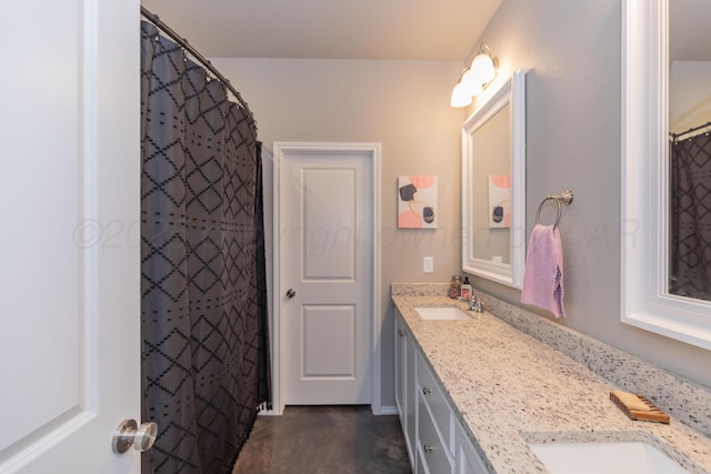 5007 Ratliff St, Amarillo, TX 79118 - bathroom with double vanity and concrete floors