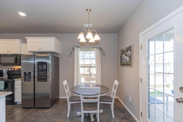 5007 Ratliff St, Amarillo, TX 79118 - dining space featuring healthy amount of natural light and a chandelier