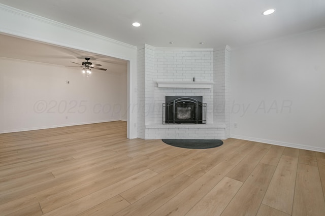 514 Melody Ln, Amarillo, TX 79118 - unfurnished living room featuring crown molding, light wood finished floors, a ceiling fan, a fireplace, and baseboards