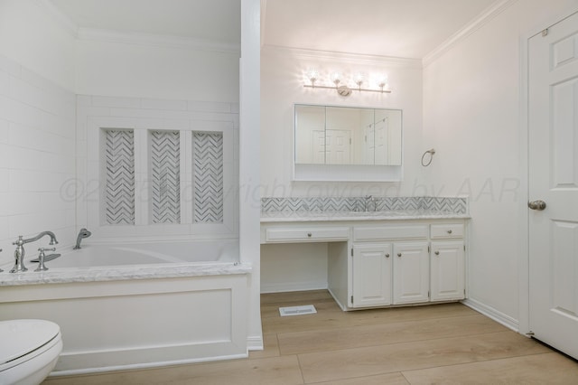 514 Melody Ln, Amarillo, TX 79118 - full bath with vanity, ornamental molding, a bath, toilet, and wood finished floors