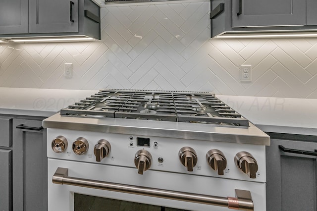 514 Melody Ln, Amarillo, TX 79118 - kitchen view of gas range oven, decorative backsplash, and light countertops
