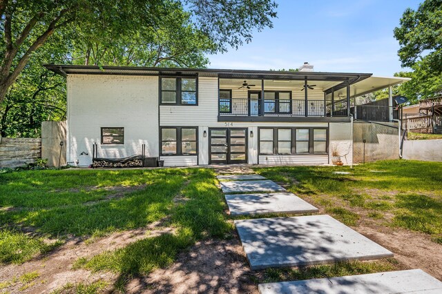 514 Melody Ln, Amarillo, TX 79118 - rear view of property with french doors, a ceiling fan, a balcony, a chimney, and a lawn