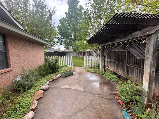 fenced backyard featuring a patio and a pergola