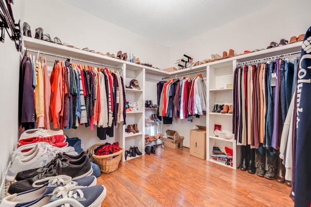 spacious closet with wood finished floors