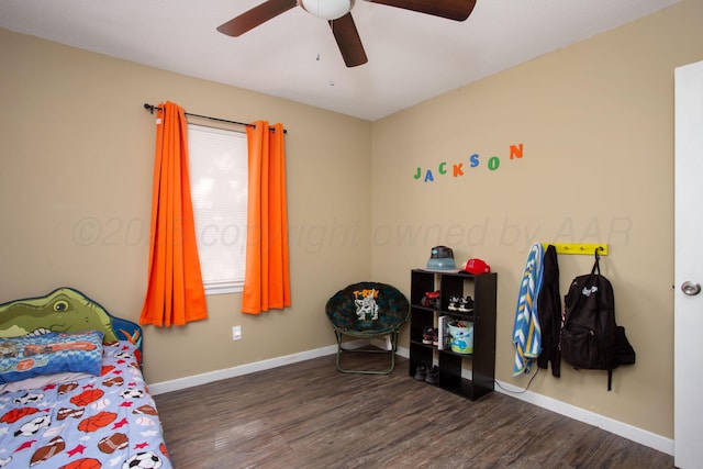 bedroom with wood finished floors, baseboards, and a ceiling fan