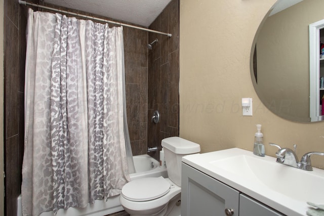 bathroom featuring shower / tub combo with curtain, toilet, vanity, and a textured ceiling