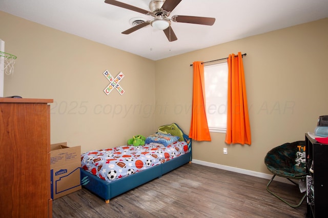 bedroom with wood finished floors, baseboards, and ceiling fan