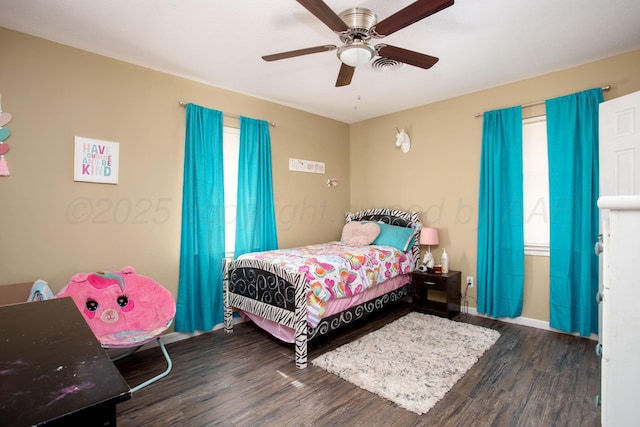 bedroom with wood finished floors and ceiling fan